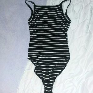 A black and white body suit